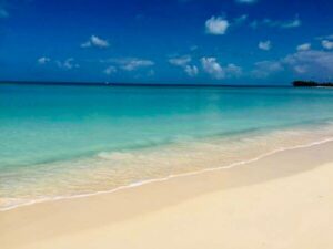 a beach with clear blue water